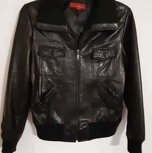 Black genuine leather jacket waist length 4 front pockets zip up high collar